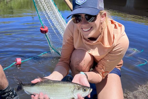 Isabel Tiller holding juvenile tarpon